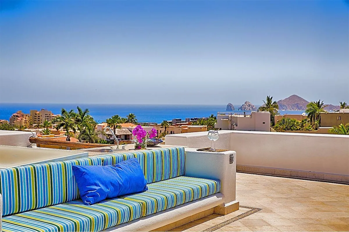 Striped rooftop sofa with Land's End in the distance