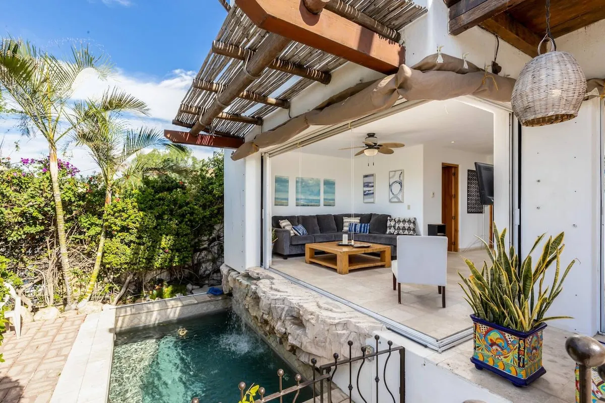 Dipping pool and reed pergola opening onto the living room